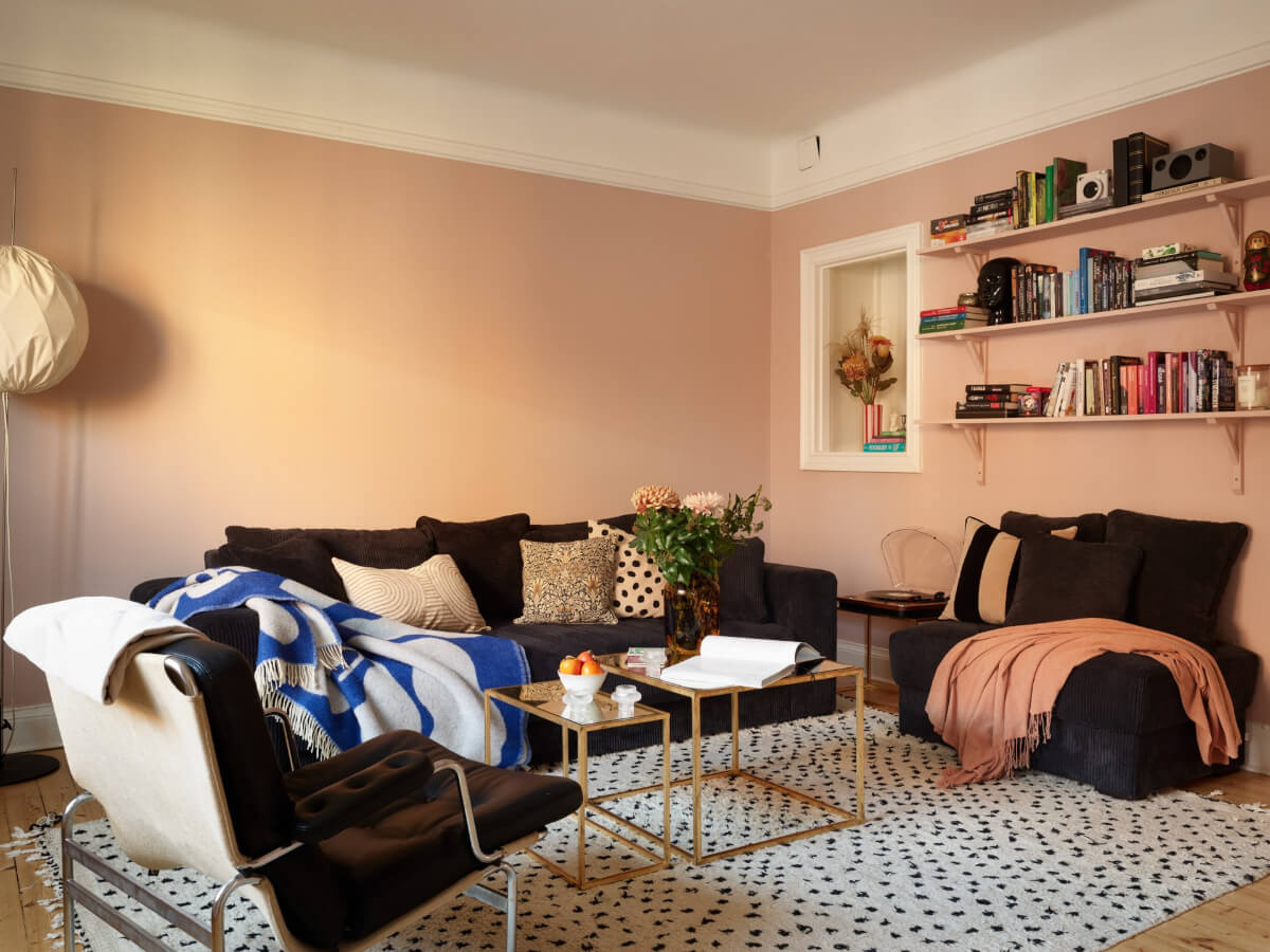 Historic Charm and an Industrial Glass Wall in a Stockholm Apartment 12 living room pink walls shelves