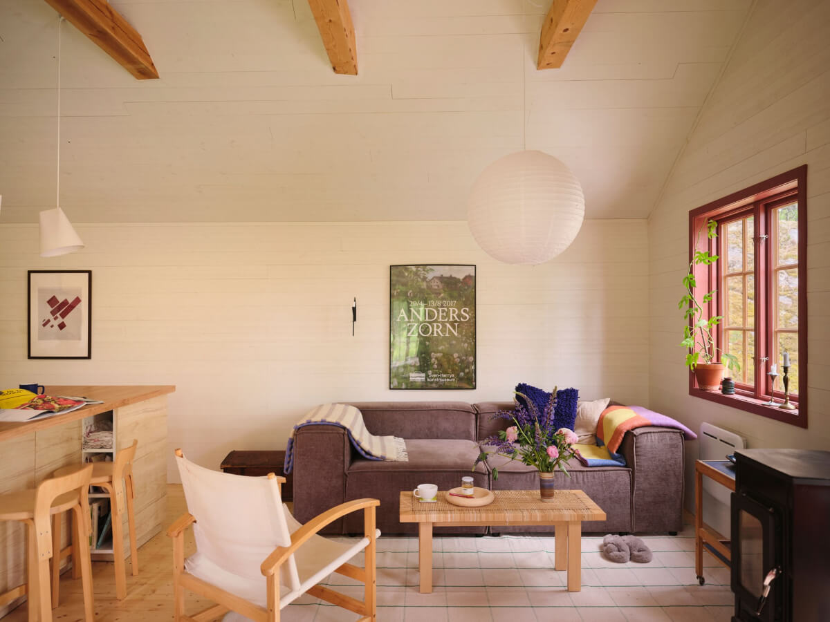 A Charming, Extended 19th-Century Log House in Sweden 3 living room red window frame