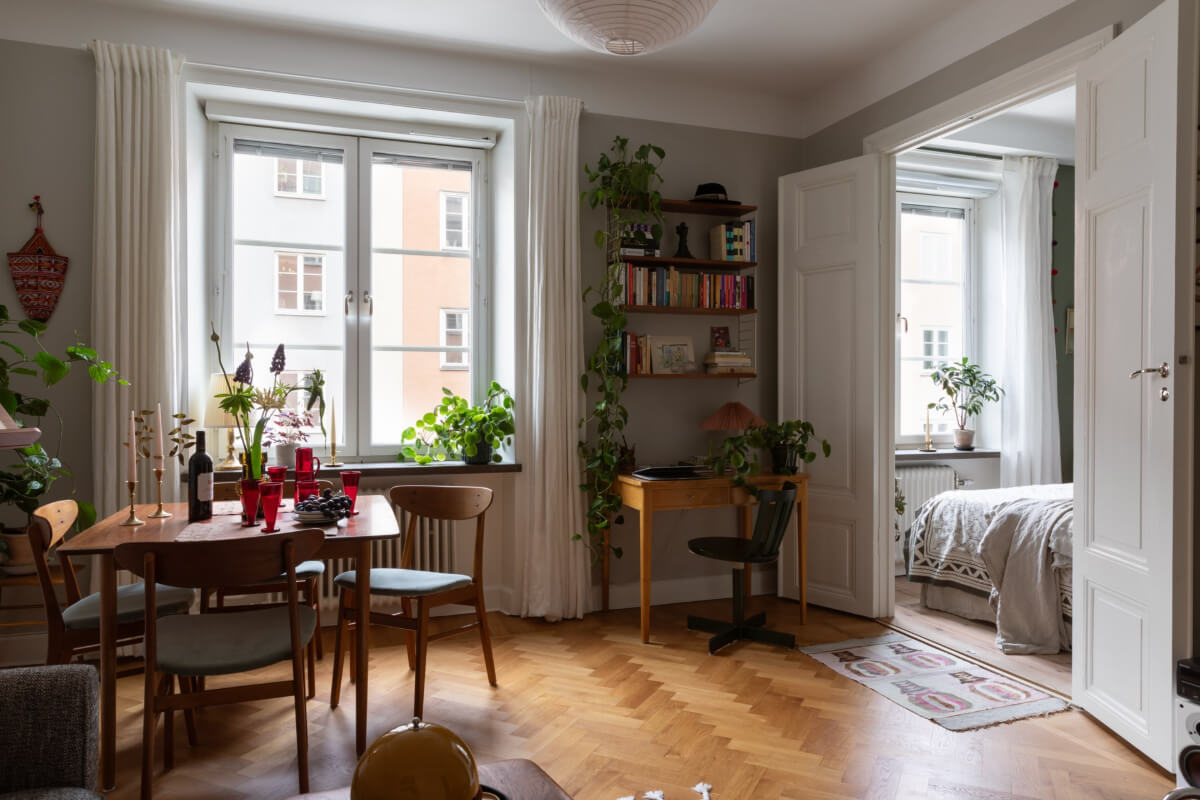 A Nice Color Palette and Original Elements in a Cozy 1930s Apartment 2 living room small home office herringbone parquet floor