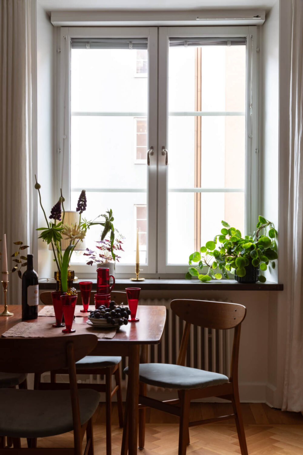 A Nice Color Palette and Original Elements in a Cozy 1930s Apartment 4 living room windows