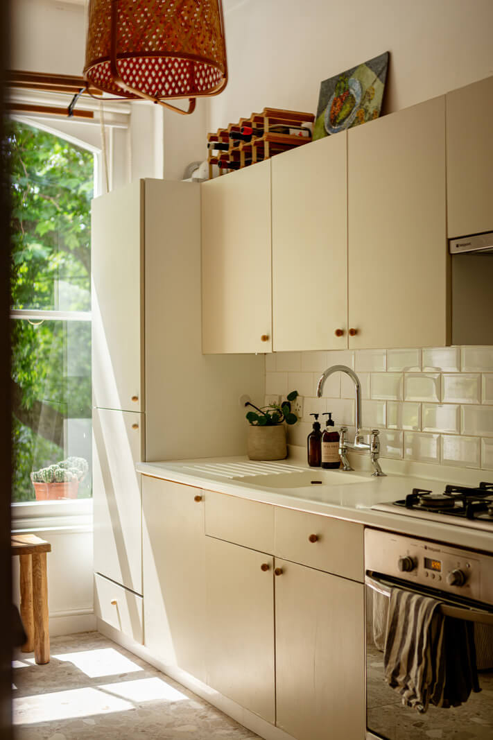 Muted Gray Tones and Built-In Storage in a London Apartment 10 modern kitchen terrazzo floor