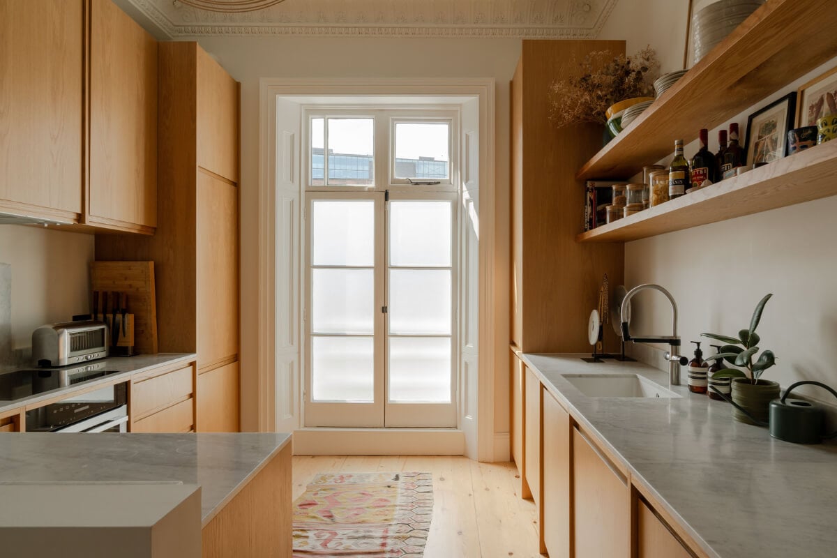 Historic Charm and Modern Design in a Light-Filled Pimlico Apartment 12 oak kitchen cabinets marble countertop Historic Charm and Modern Design in a Light-Filled Pimlico Apartment