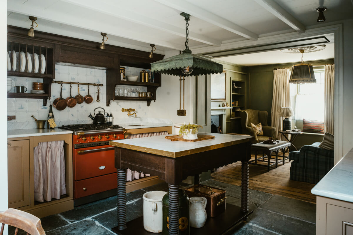 Bespoke Interiors and an Earthy Color Palette in a Historic Cottage 5 open-plan living area mustard kitchen with island