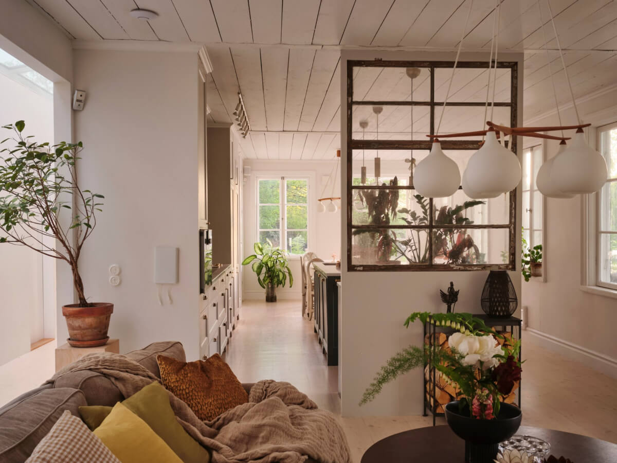 This Extended 19th Century Lakeside House is a Green Oasis in the City 5 open-plan living space reclaimed window room divider
