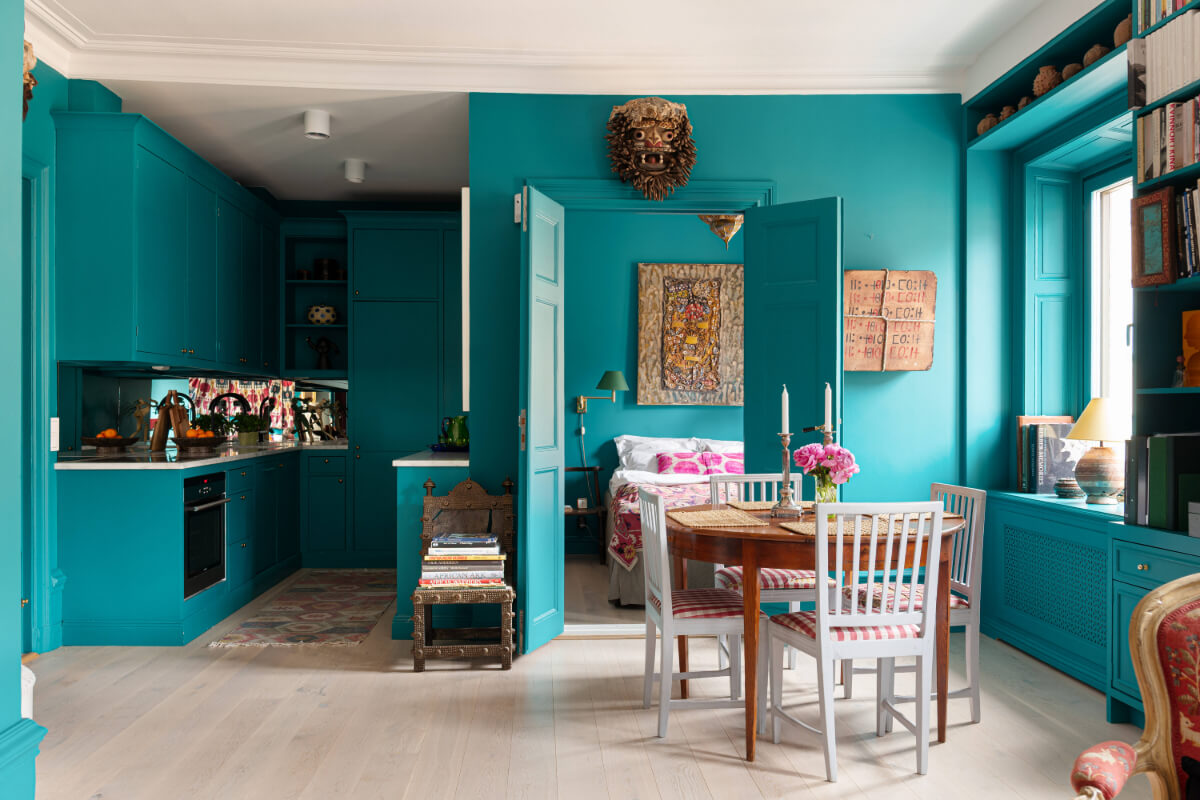 Bold Teal Walls and Antiques in a Turn-of-the-Century Apartment 9 open plan teal living space