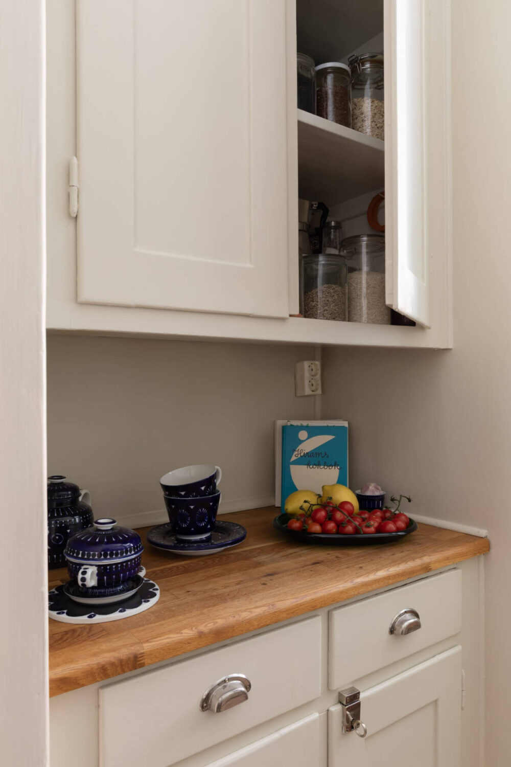 A Nice Color Palette and Original Elements in a Cozy 1930s Apartment 18 original built-in kitchen pantry cabinets