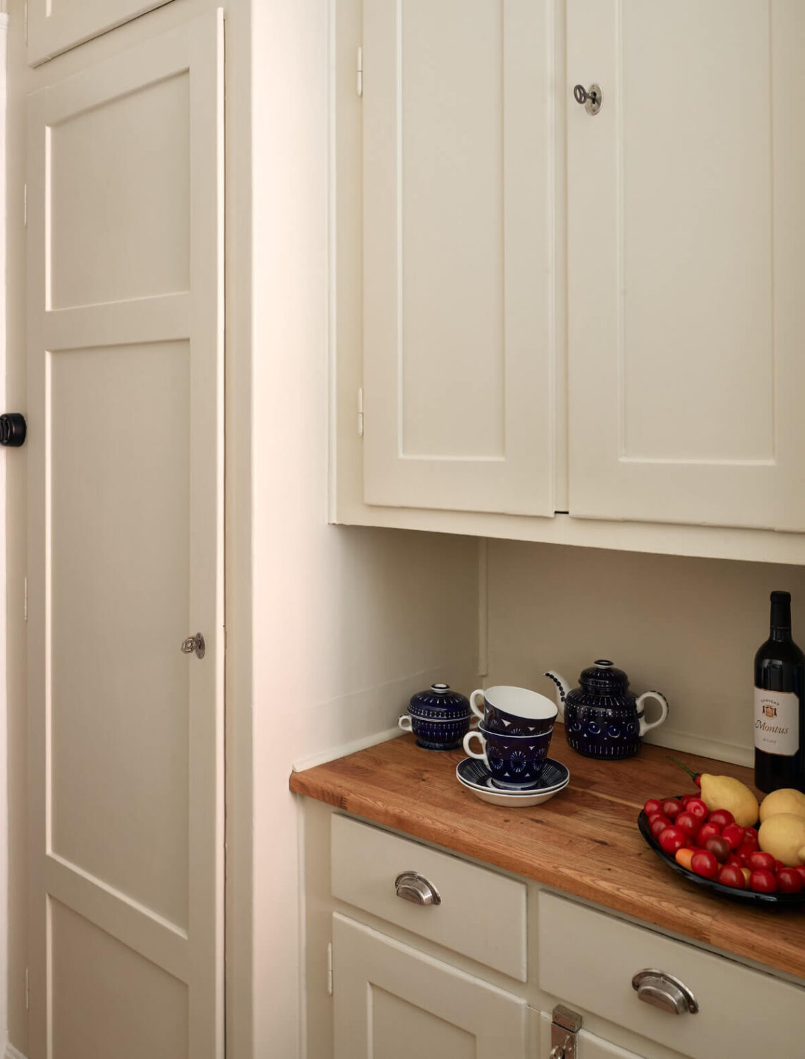 A Nice Color Palette and Original Elements in a Cozy 1930s Apartment 19 original cabinets kitchen