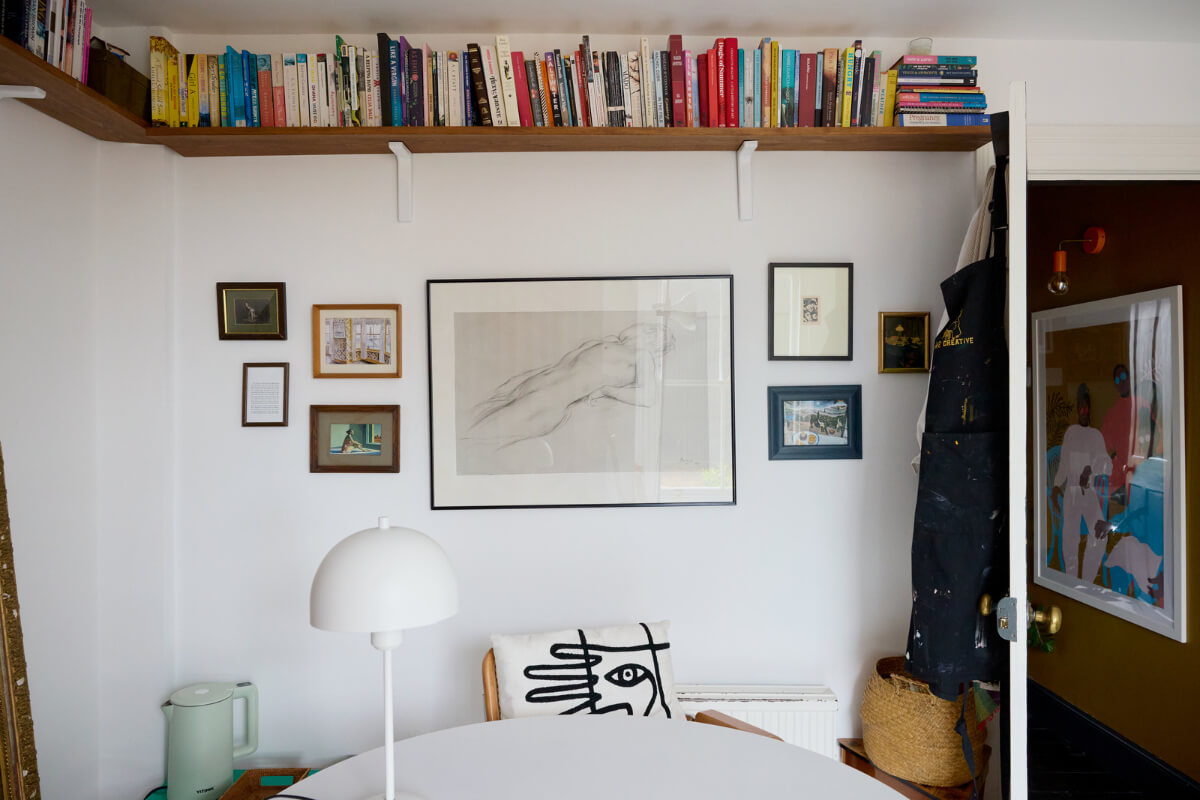 Cozy Living Spaces and Limewash Walls in an Artist's English Home 13 paint studio high bookshelves