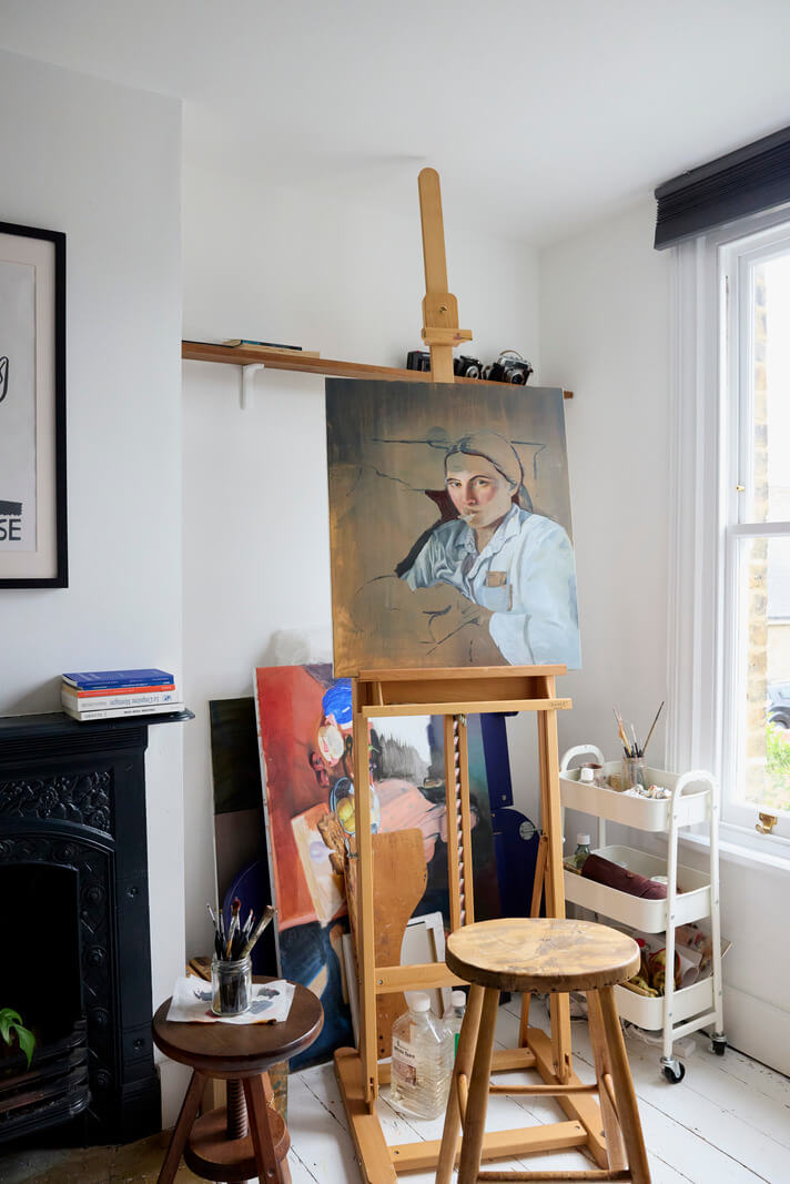 Cozy Living Spaces and Limewash Walls in an Artist's English Home 15 paint studio original fireplace