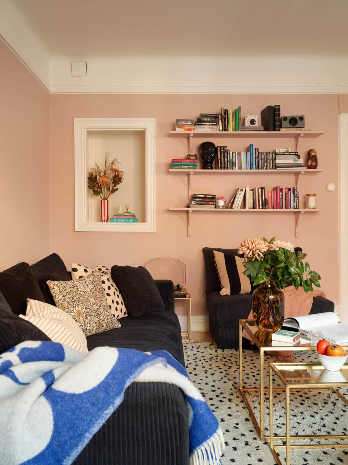 Historic Charm and an Industrial Glass Wall in a Stockholm Apartment 14 pink and green living room large black and white rug