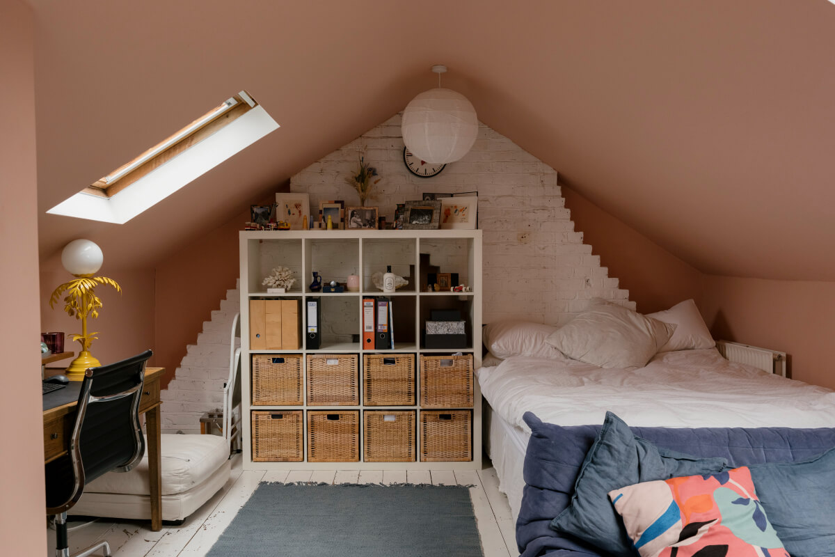 A Victorian Family House with a Tuscan-Inspired Kitchen Extension 31 pink attic bedroom exposed stone wall