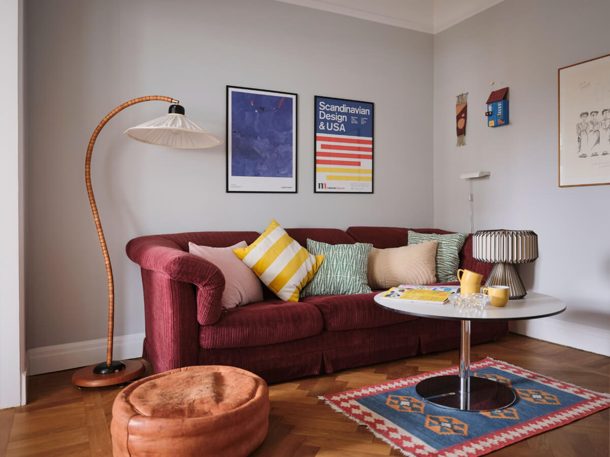An Early 20th Century Apartment with a Muted Green Kitchen 10 pink sofa television room