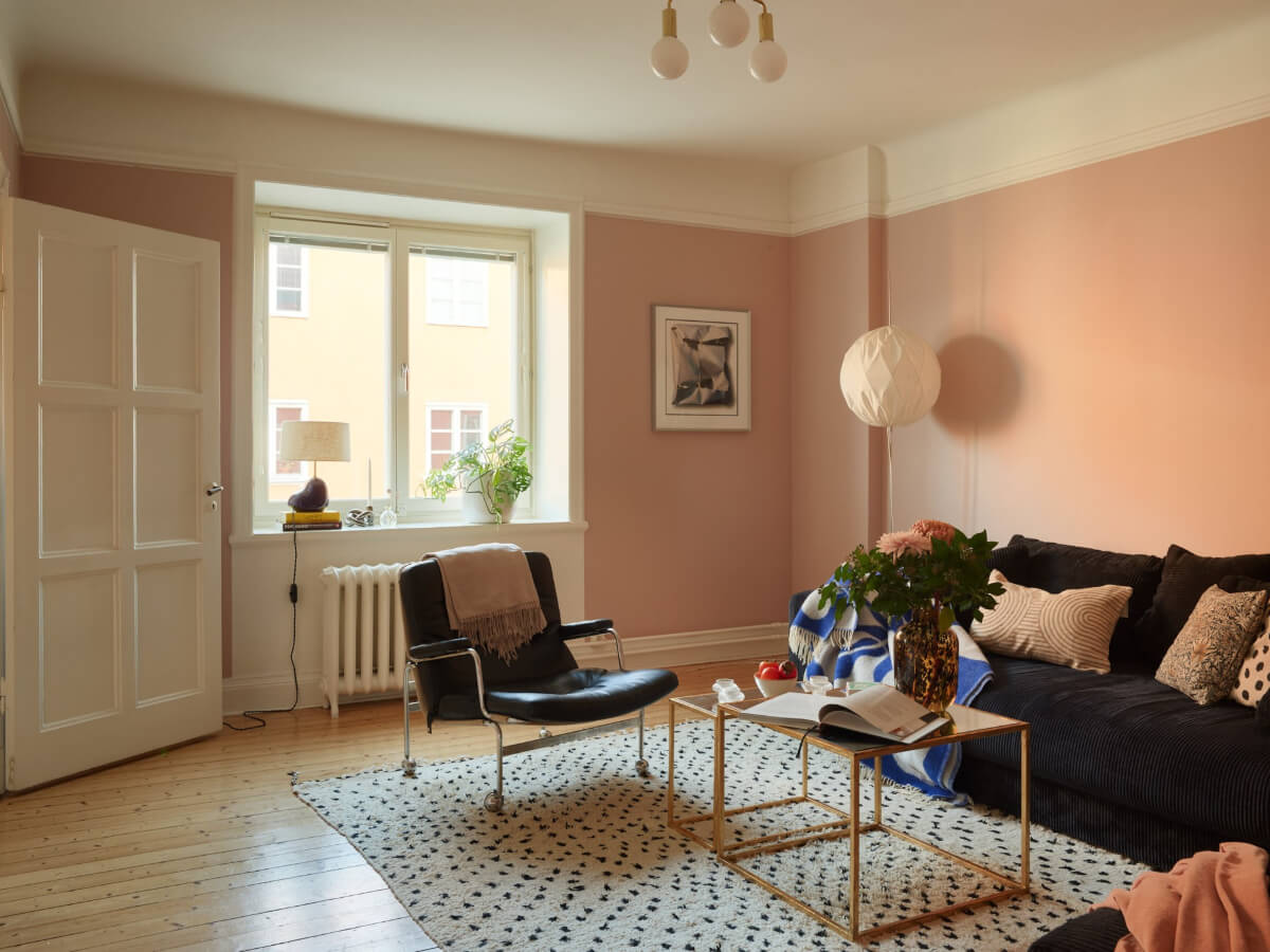 Historic Charm and an Industrial Glass Wall in a Stockholm Apartment 11 pink walls living room