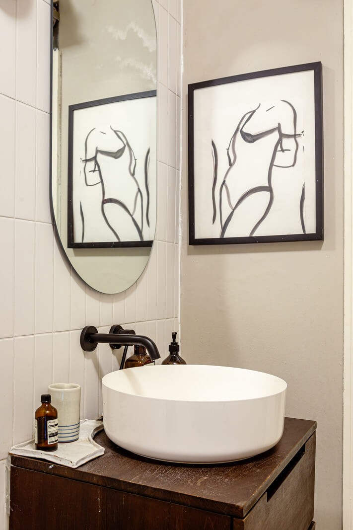 Muted Gray Tones and Built-In Storage in a London Apartment 20 round bathroom sink black fittings Muted Gray Tones and Built-In Storage in a London Apartment