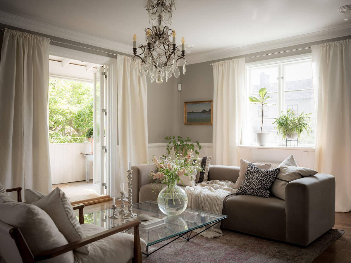 A Floral Painted Ceiling in a 1920s Family Home in Sweden 2 scandi living room open doors to veranda