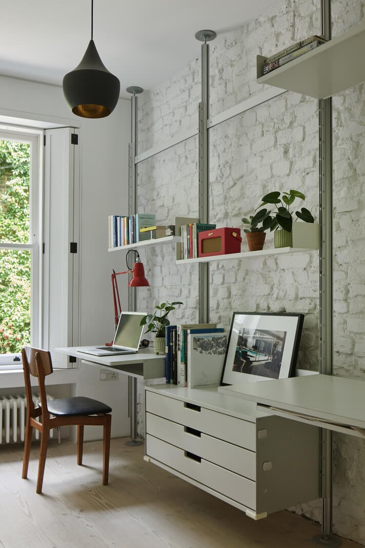 A Black and White Primrose Hill Mews House with a Roof Terrace 16 shelving system with desk brick wall