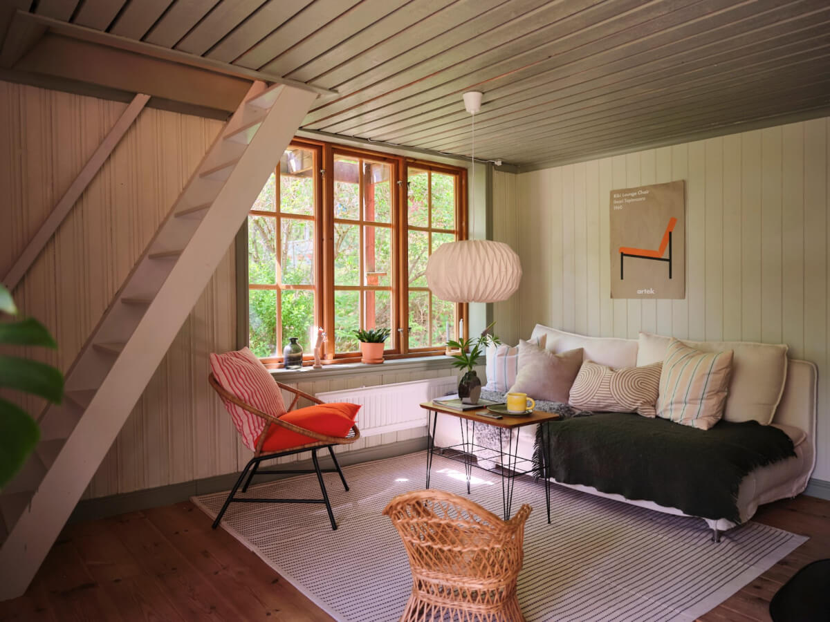 A Charming, Extended 19th-Century Log House in Sweden 17 sitting area gray ceiling