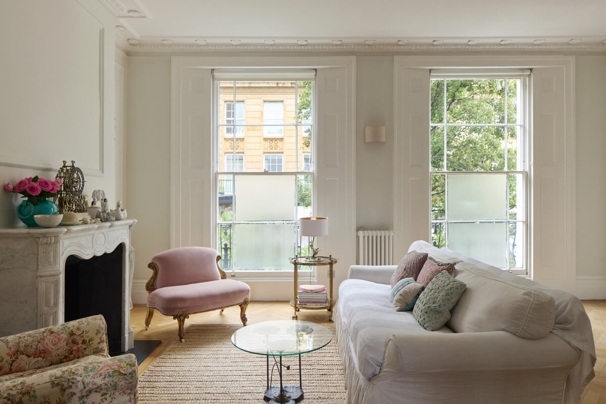 Light-Filled Interiors in a Grand Early Victorian House in Notting Hill 17 sitting area large windows fireplace