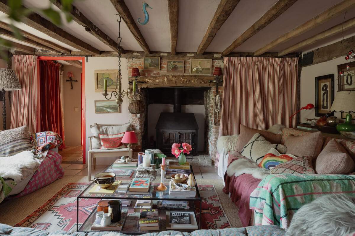 Colorful Interiors and Period Features in a 16th-Century Farmhouse 14 sitting room brick fireplace