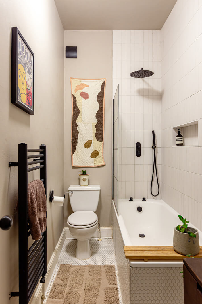 Muted Gray Tones and Built-In Storage in a London Apartment 19 small bathroom white tiles gray walls