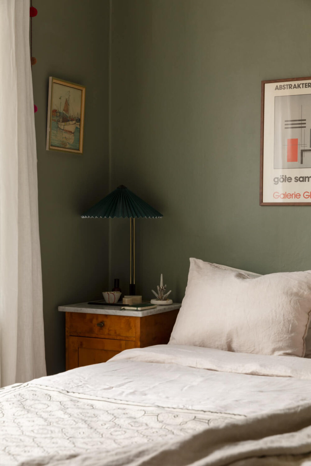 A Nice Color Palette and Original Elements in a Cozy 1930s Apartment 9 small green bedroom antique nightstand marble top