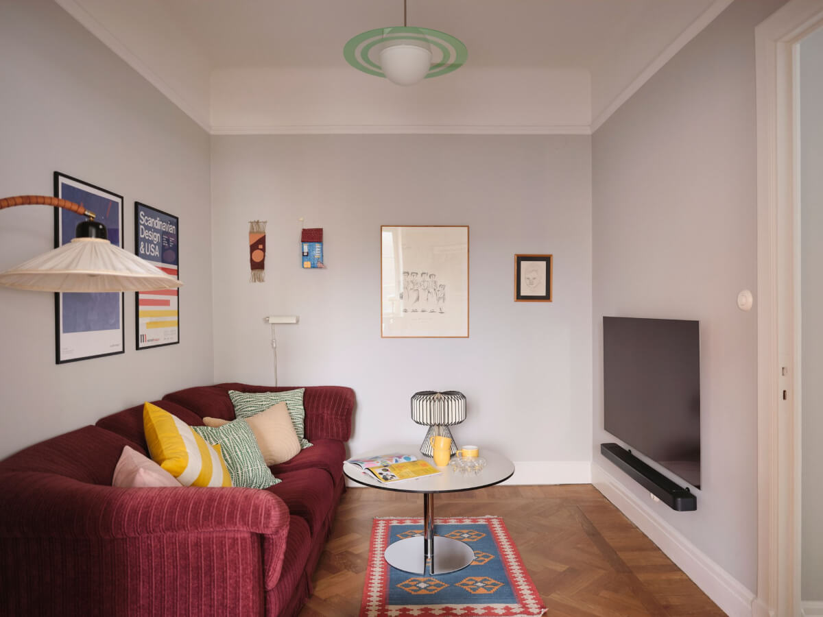 An Early 20th Century Apartment with a Muted Green Kitchen 9 small sitting room pink sofa