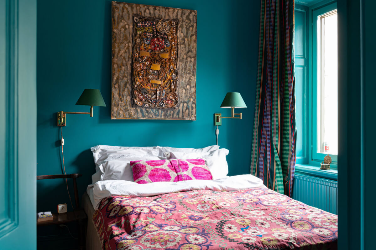 Bold Teal Walls and Antiques in a Turn-of-the-Century Apartment 16 small teal bedroom colorful textiles