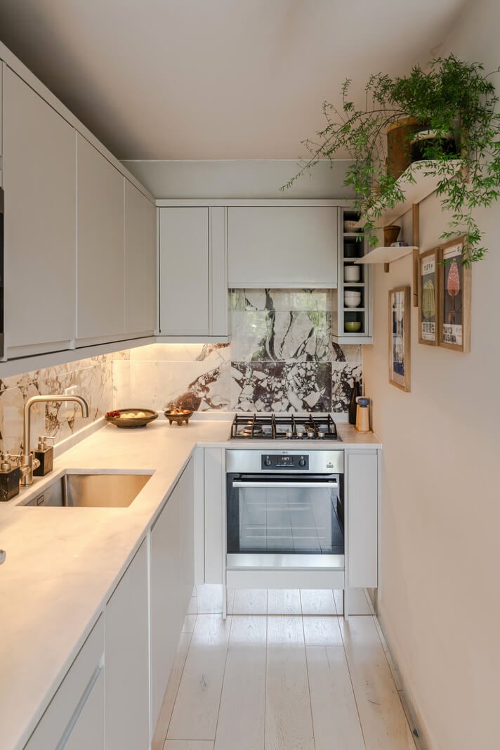 A High-Pitched Ceiling In a Light London Duplex Apartment 8 small white kitchen marble backsplash A High-Pitched Ceiling In a Light London Duplex Apartment