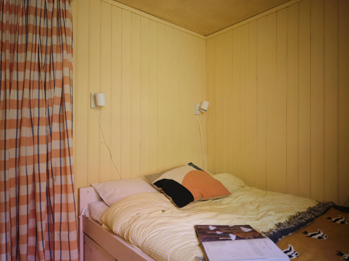 A Charming, Extended 19th-Century Log House in Sweden 29 small yellow bedroom