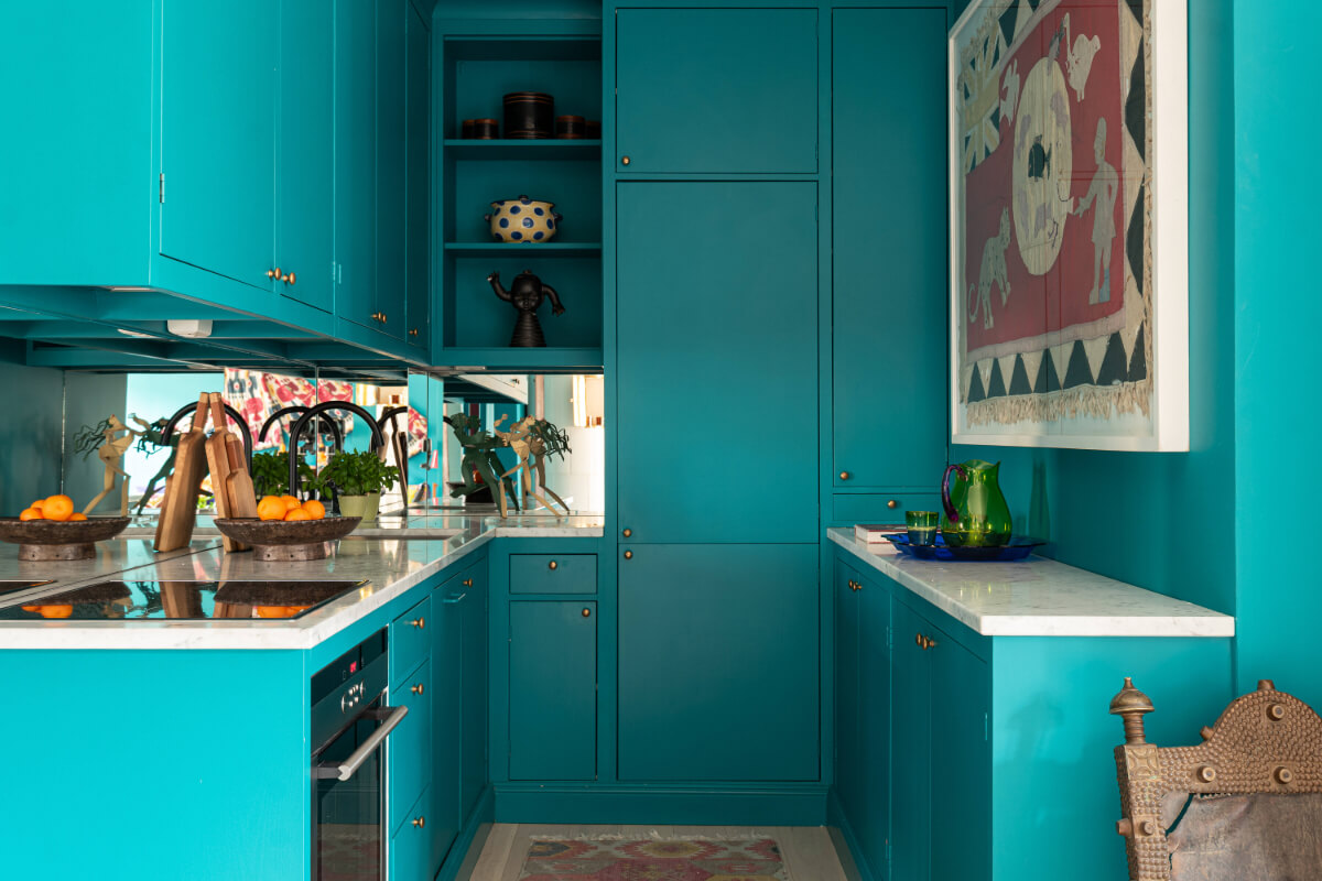 Bold Teal Walls and Antiques in a Turn-of-the-Century Apartment 11 teal kitchen brass fittings