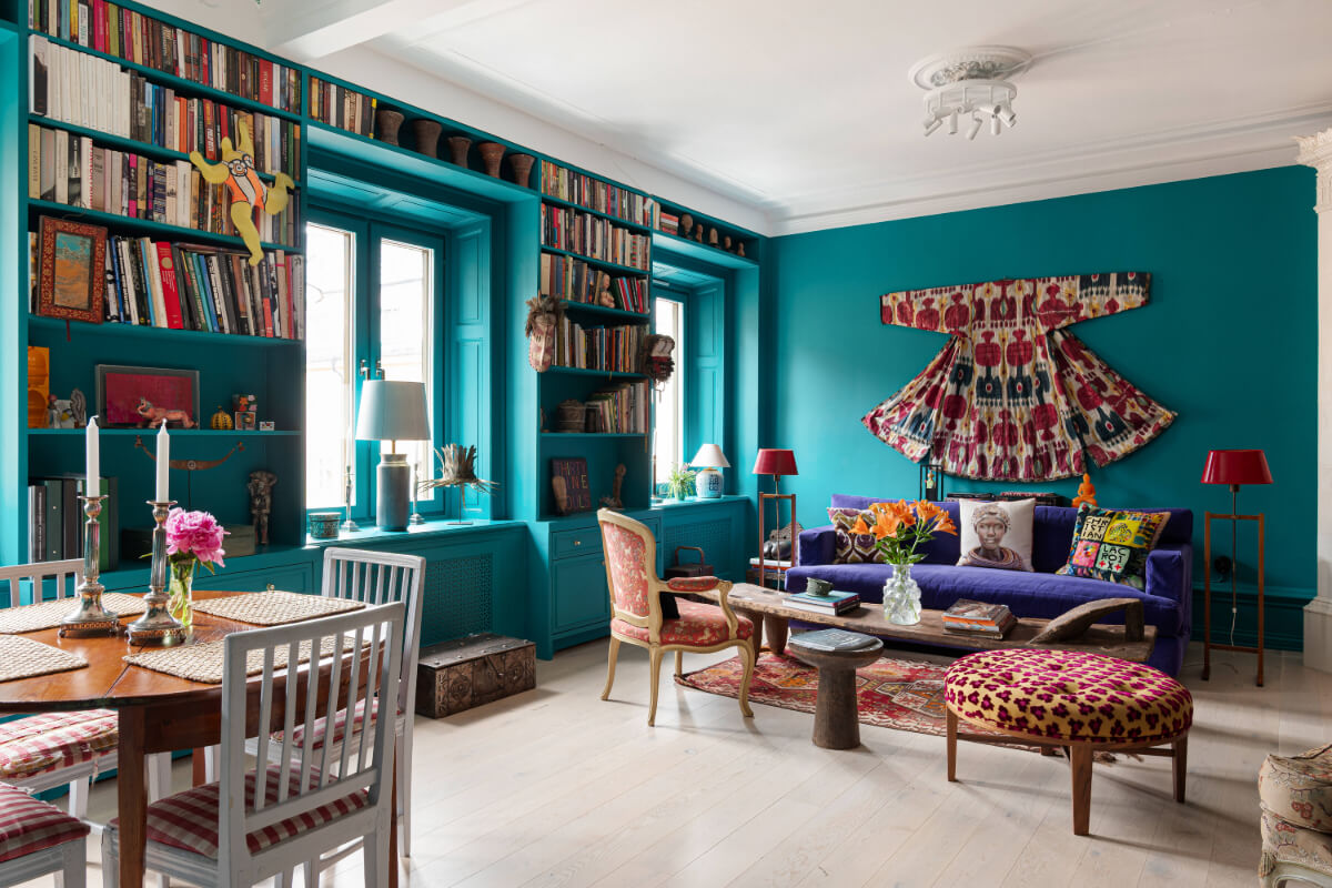 teal living room bookcases around window