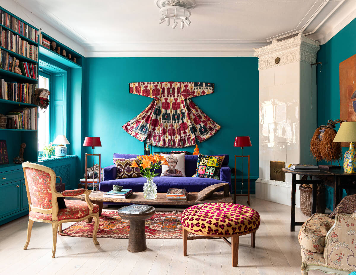 Bold Teal Walls and Antiques in a Turn-of-the-Century Apartment 2 teal living room colorful furnishings