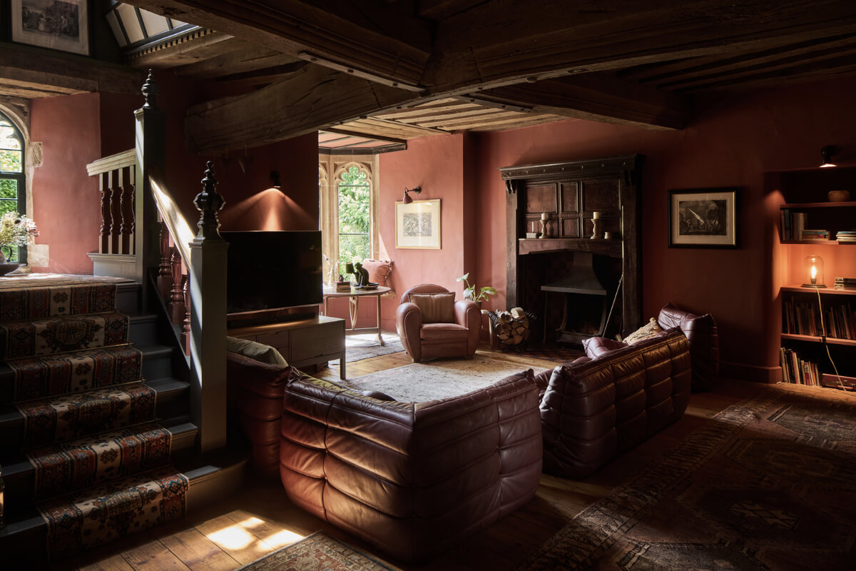 Unique Rooms and Historic Splendor in a Medieval English Country House 5 terracotta pink sitting room exposed timber