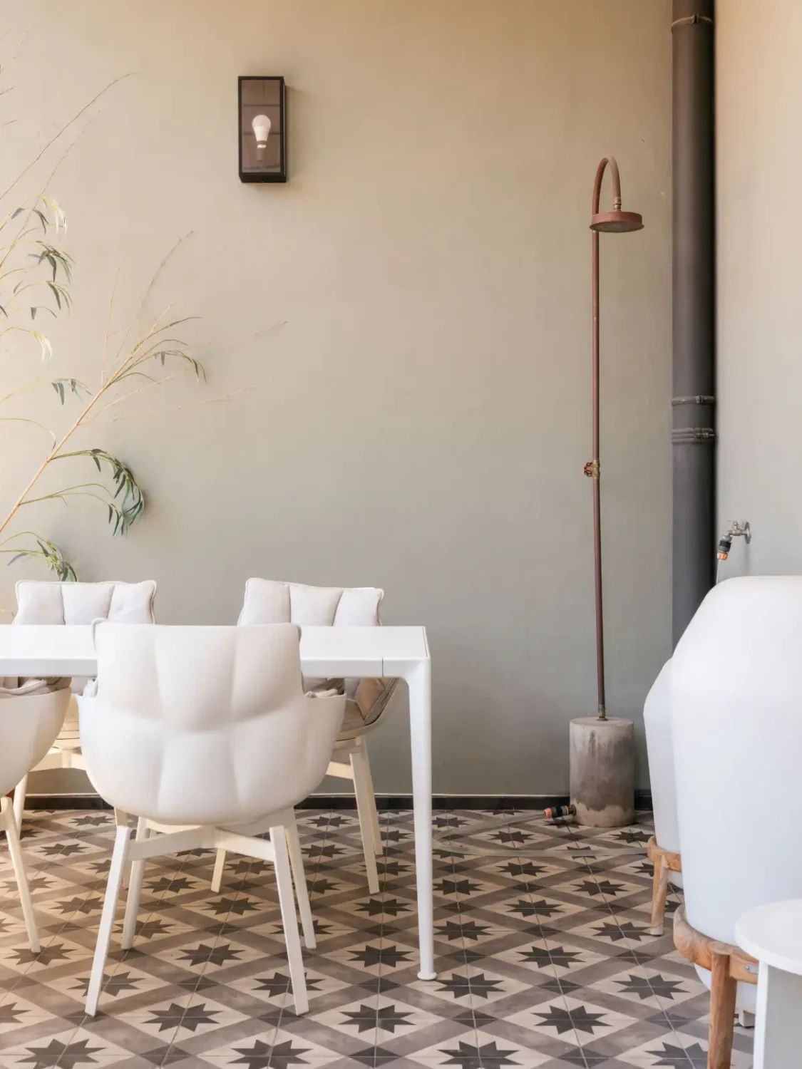 An Eye-Catching Stone Wall in a Beautiful Lisbon Apartment 10 tiled terrace