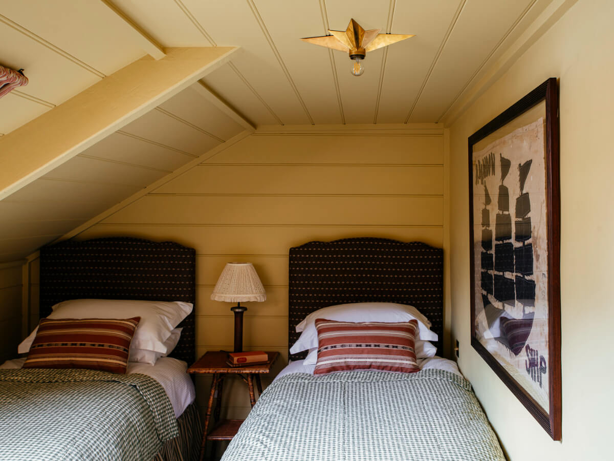 Bespoke Interiors and an Earthy Color Palette in a Historic Cottage 20 twin bedroom paneled walls ceiling