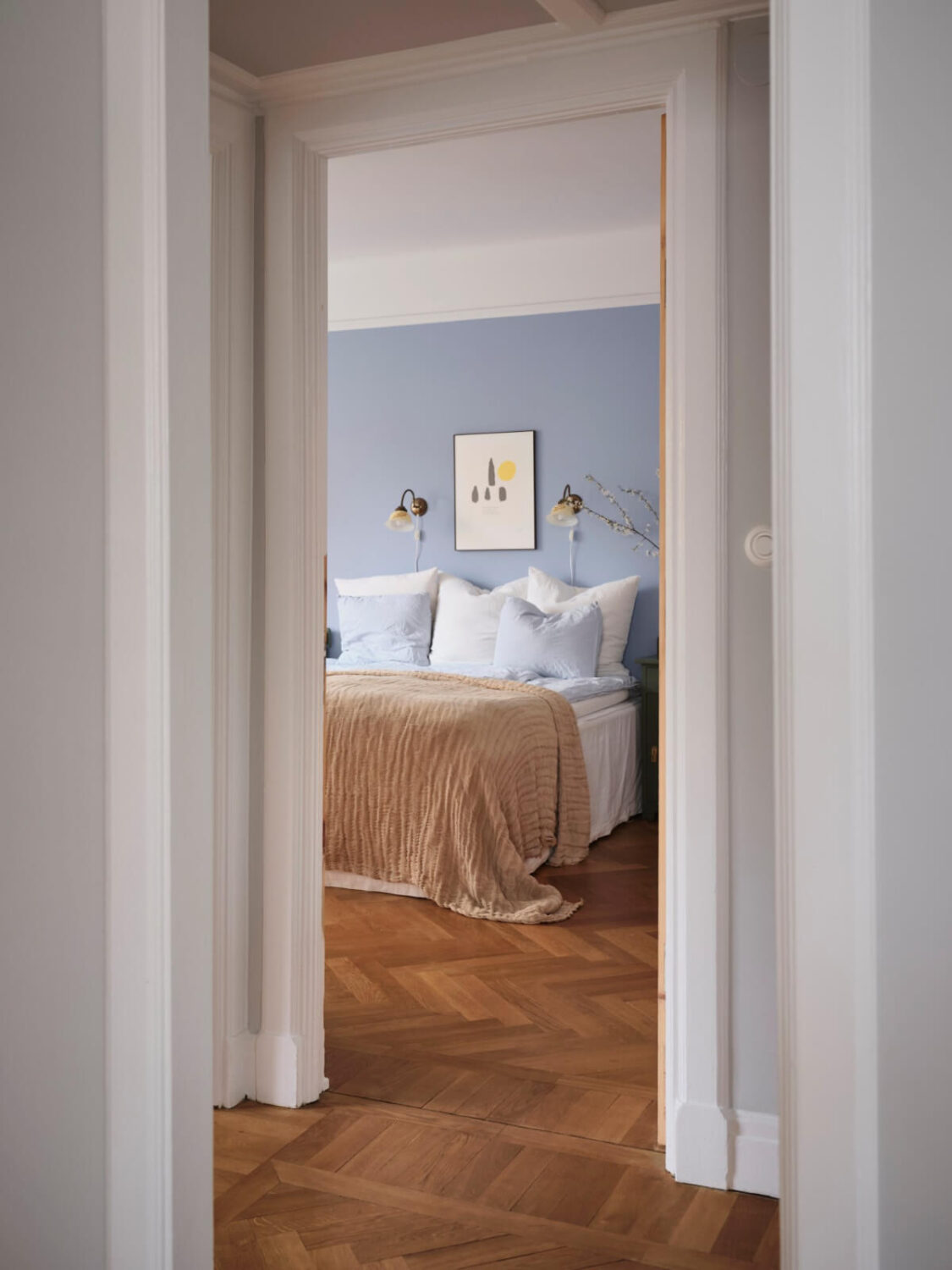 An Early 20th Century Apartment with a Muted Green Kitchen 13 view into bedroom