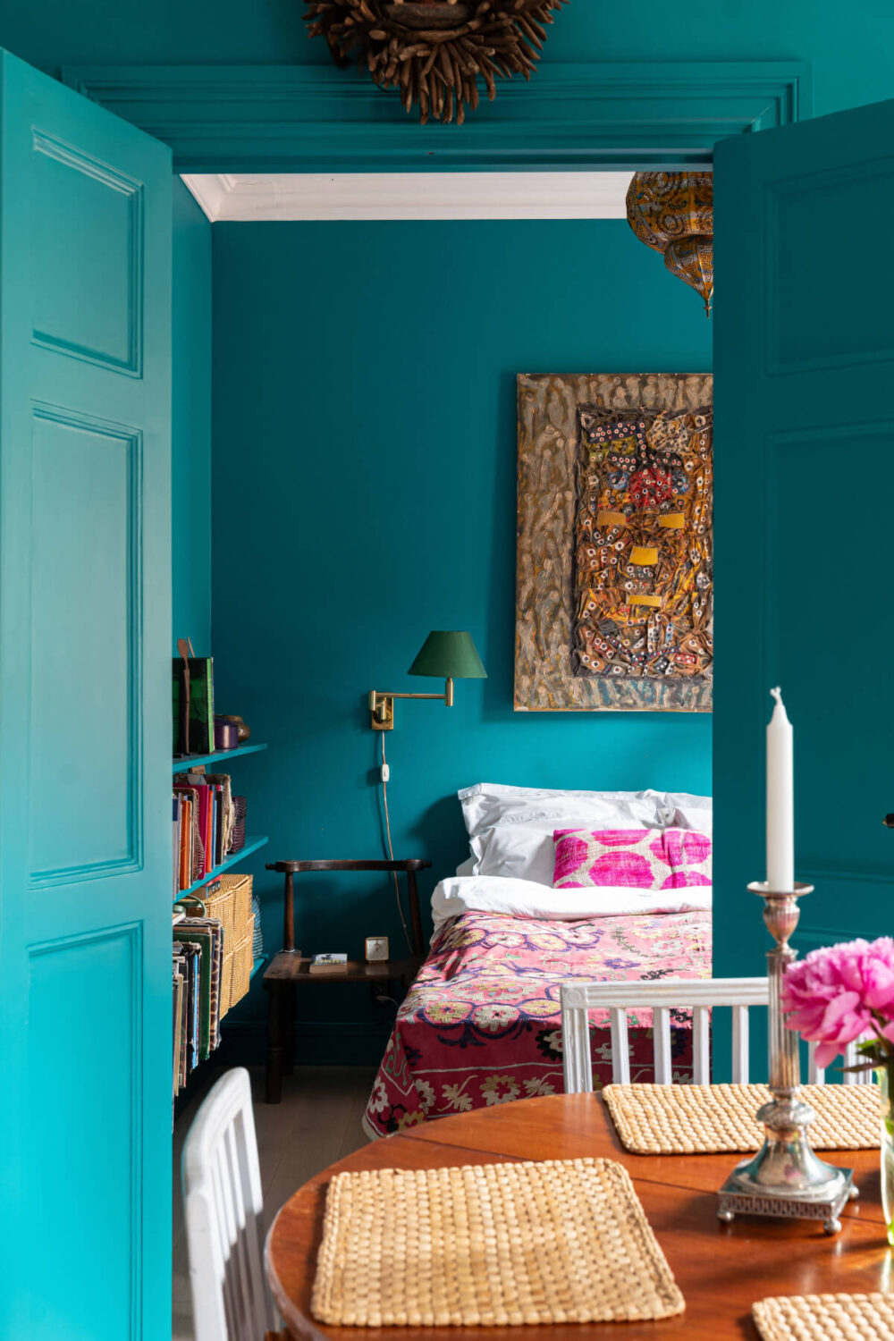 Bold Teal Walls and Antiques in a Turn-of-the-Century Apartment 15 view into bedroom