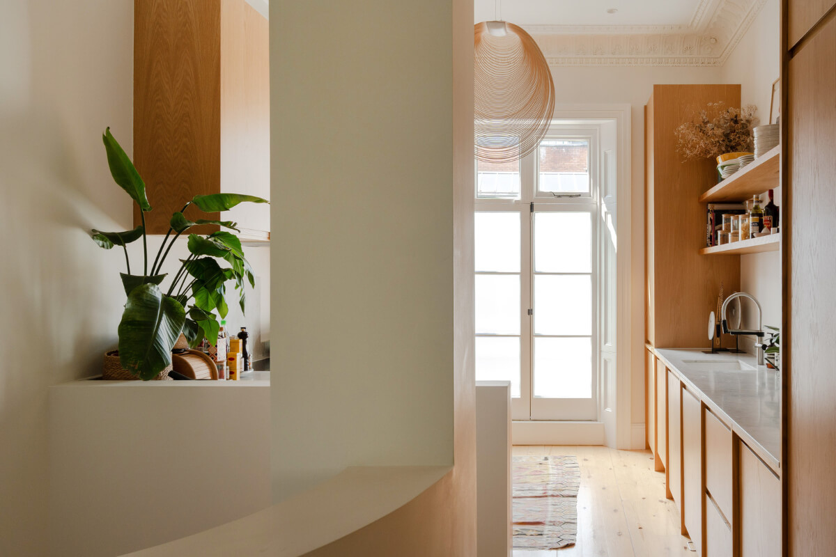 Historic Charm and Modern Design in a Light-Filled Pimlico Apartment 11 view into kitchen oak cabinets