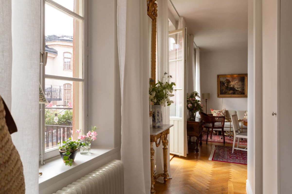 Antiques and Modern Additions in a Cozy Top Floor Duplex Apartment 29 view into living room