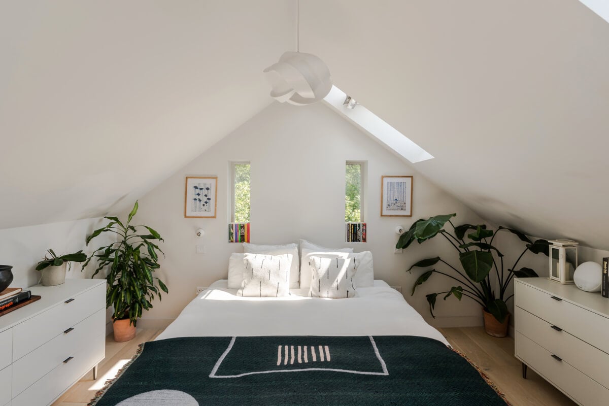 A High-Pitched Ceiling In a Light London Duplex Apartment 13 white bedroom slanted ceilings