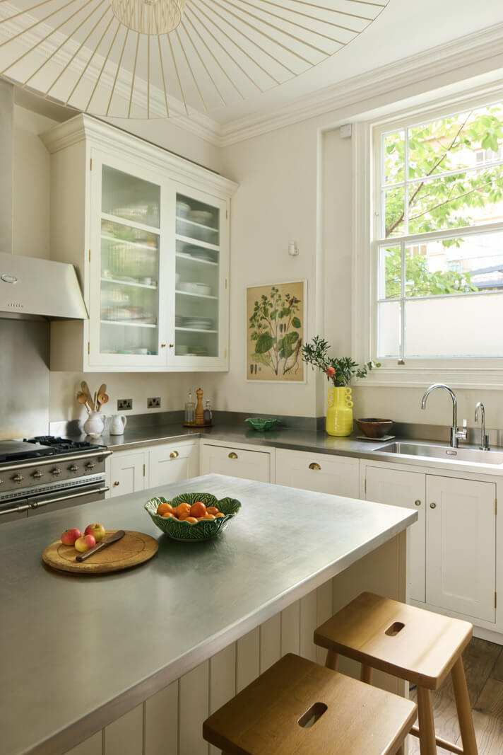 Light-Filled Interiors in a Grand Early Victorian House in Notting Hill 4 white kitchen with island stainless steel countertop