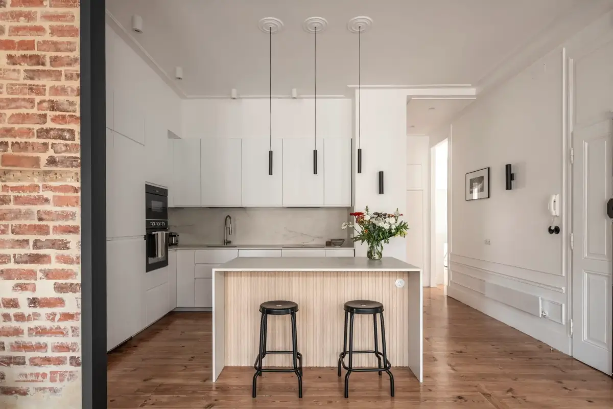 A Light-Filled Duplex Apartment in a Classical Lisbon Building 6 white kitchen with island