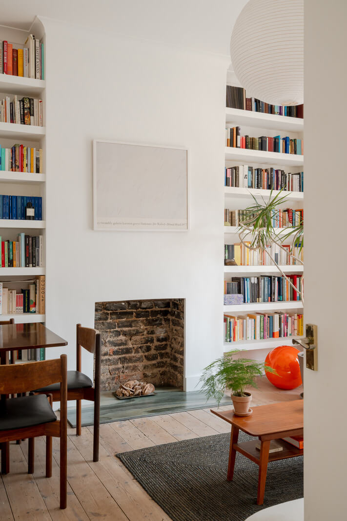 A Bright Ground Floor Apartment with a Beautiful Garden 2 white living room wooden floor bookshelves fireplace