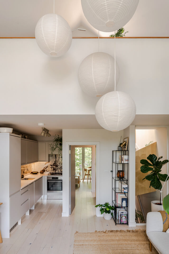 A High-Pitched Ceiling In a Light London Duplex Apartment 7 white open-plan living space mezzanine level