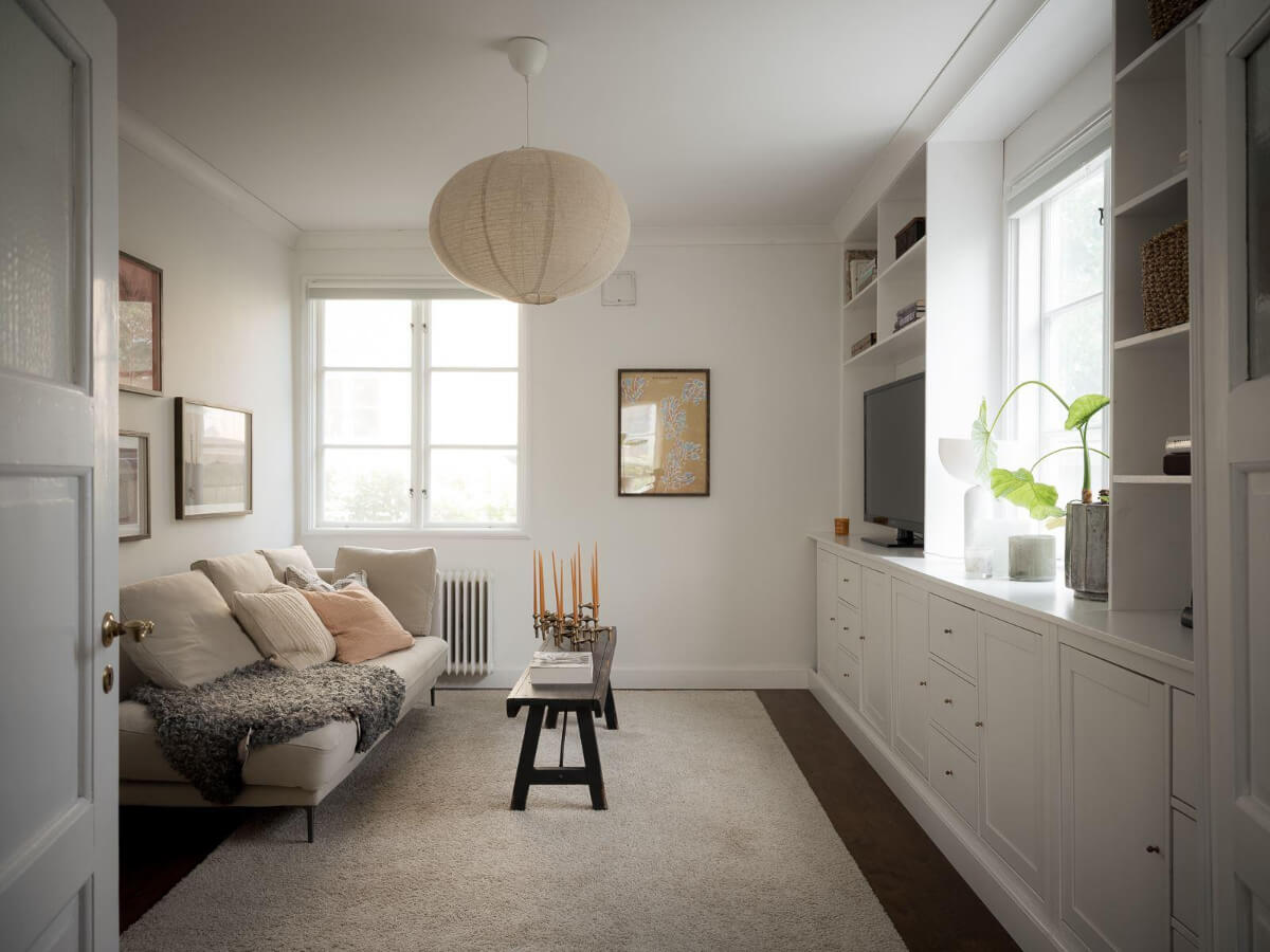 A Floral Painted Ceiling in a 1920s Family Home in Sweden 16 white television room with custom cabinets