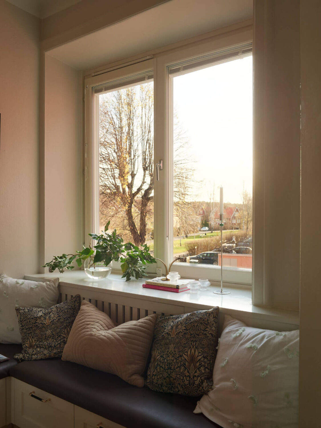 Historic Charm and an Industrial Glass Wall in a Stockholm Apartment 4 window seat