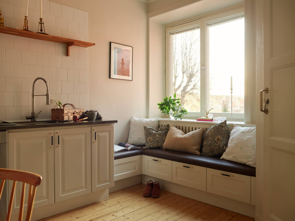 Historic Charm and an Industrial Glass Wall in a Stockholm Apartment 3 window seat bench