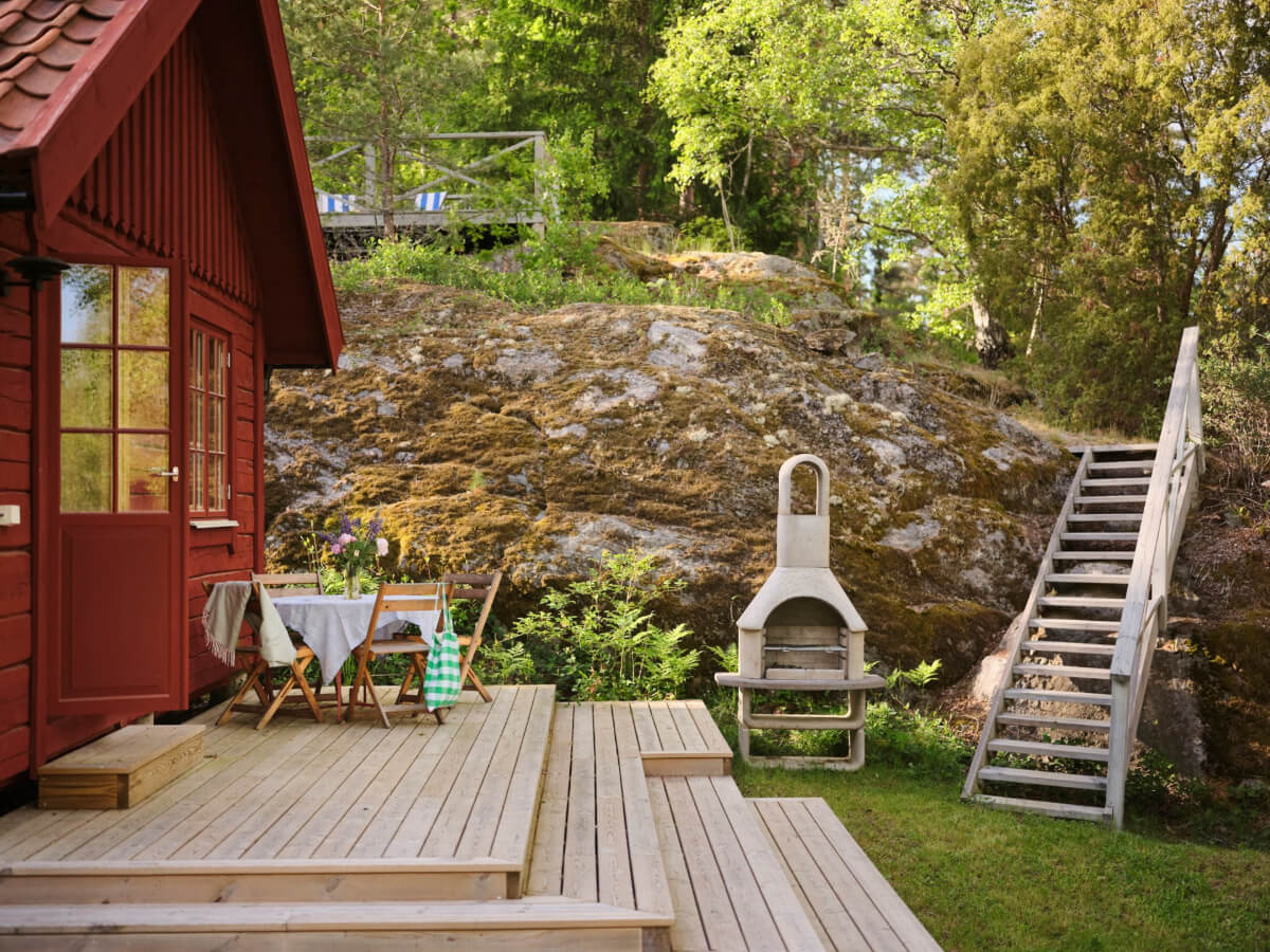 A Charming, Extended 19th-Century Log House in Sweden 37 wooden deck garden