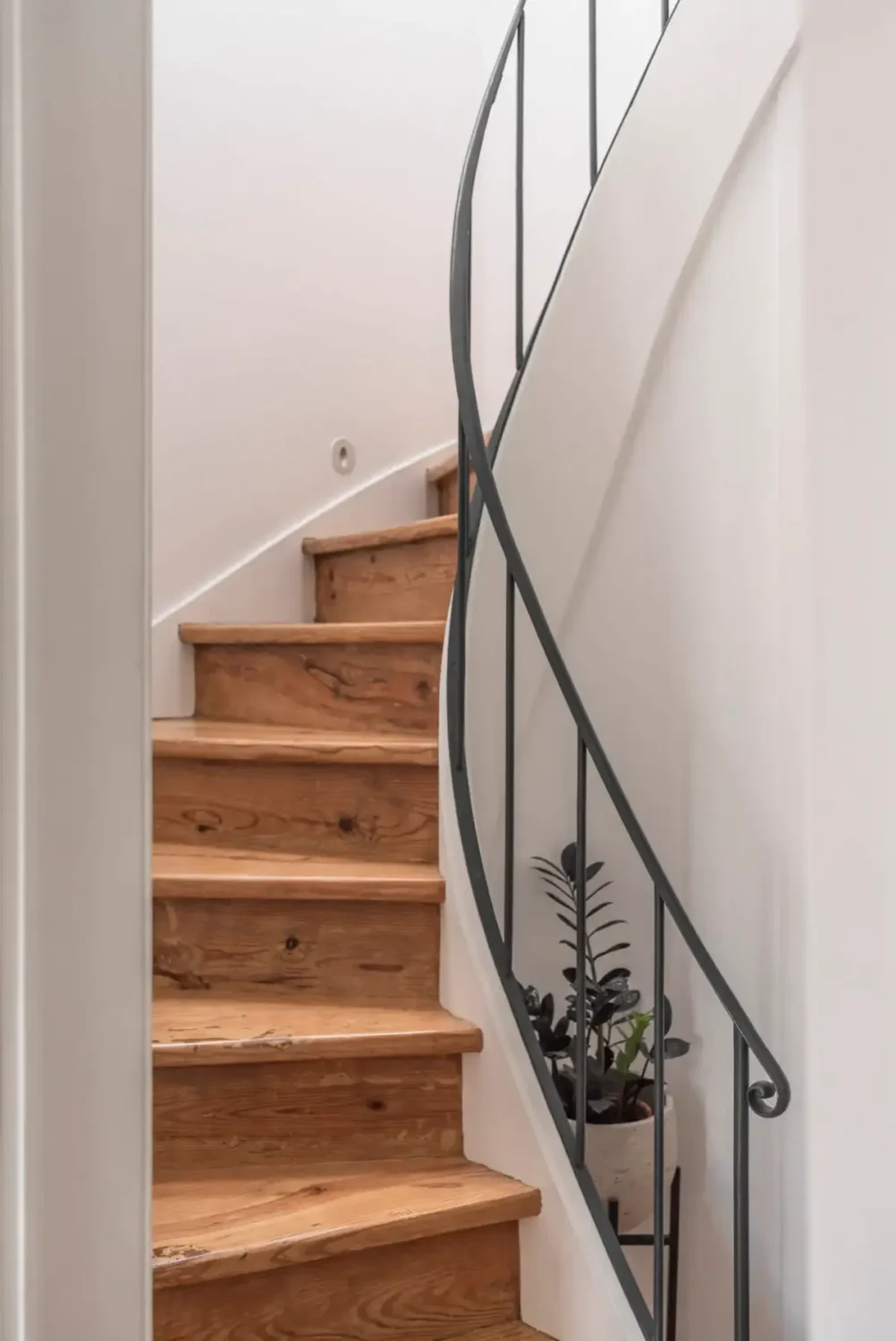 A Light-Filled Duplex Apartment in a Classical Lisbon Building 10 wooden stairs
