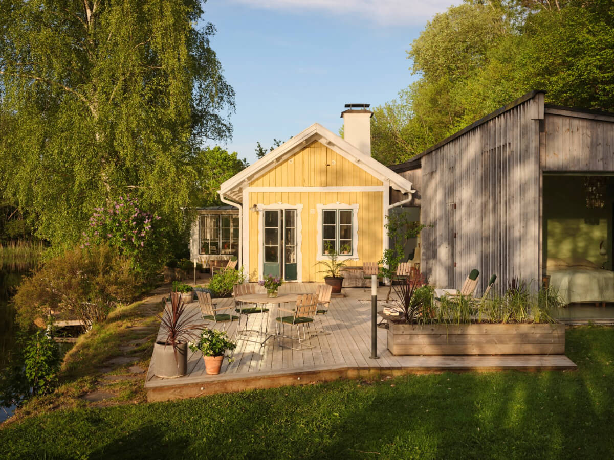 This Extended 19th Century Lakeside House is a Green Oasis in the City 1 wooden terrace
